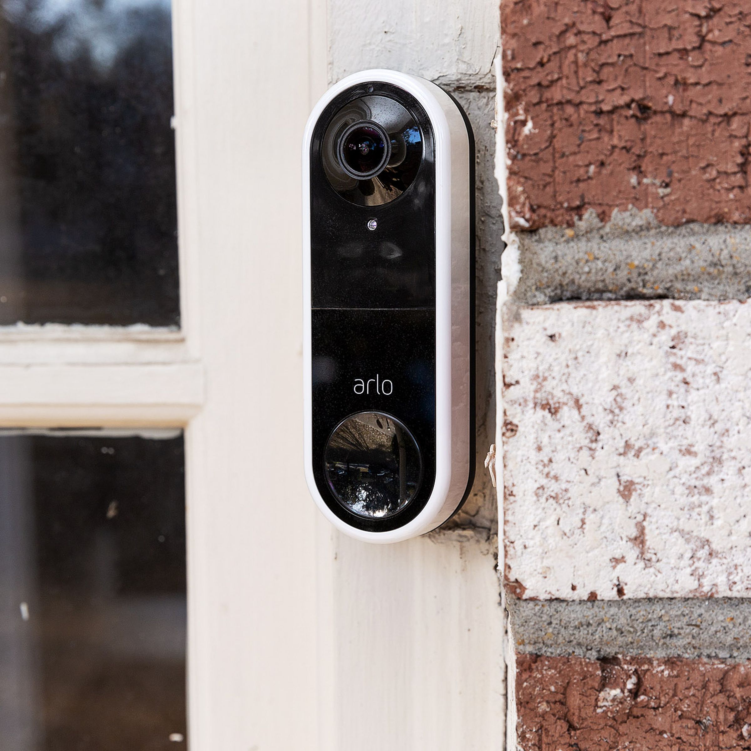 Arlo’s Essential Wired Video Doorbell installed on a front door.