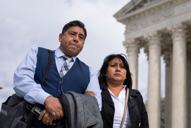 Jose Hernandez and Beatriz Gonzalez, stepfather and mother of Nohemi Gonzalez, who died in a terrorist attack in Paris in 2015, arrive to speak to the press outside of the US Supreme Court following oral arguments in <em>Gonzalez v. Google</em> on February 21 in Washington, DC. “><figcaption class=
