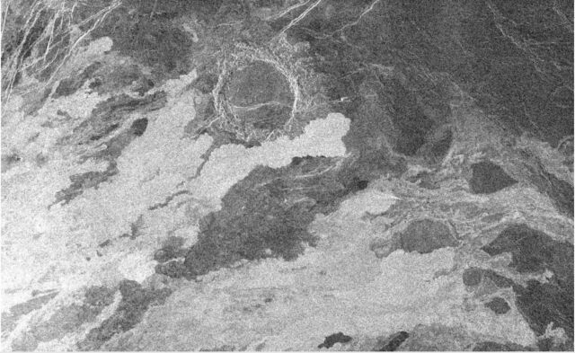 140 km wide Magellan radar image of Venus showing lava flows (bright because they are rough) that have begun to encroach on an older impact crater.