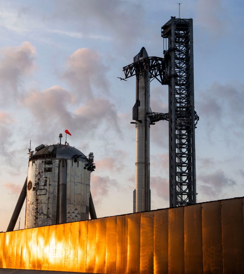 Starship and Super Heavy are ready to fly, with Starhopper in the foreground for scale.