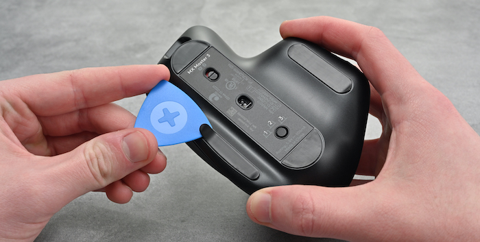 Logitech MX Master 3's feet being pried off