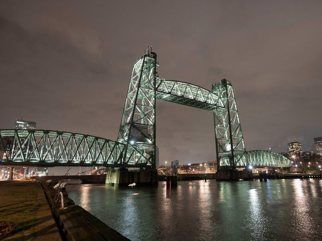 Nighttime view of De Hef bridge in Rotterdam, Netherlands