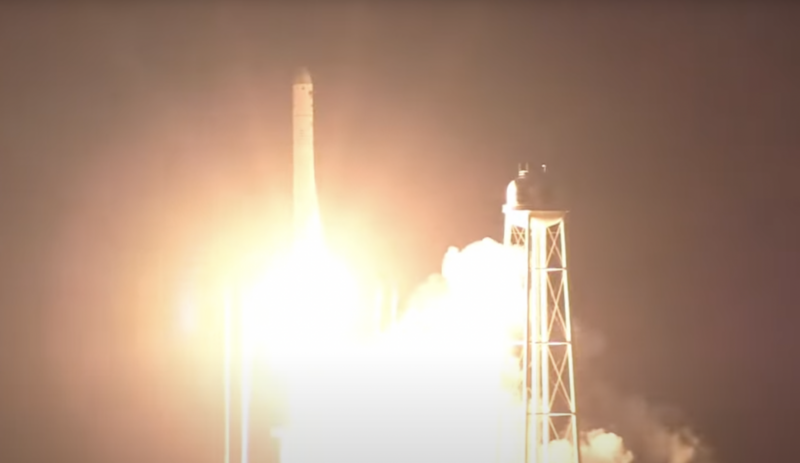 Image of a rocket leaving its launch pad at night.