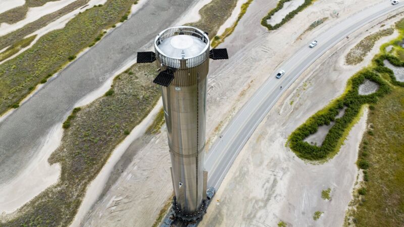 SpaceX's Super Heavy booster, numbered Booster 9, rolls back to its launch pad in Texas for more testing. The rocket now has a new structural staging ring on top.