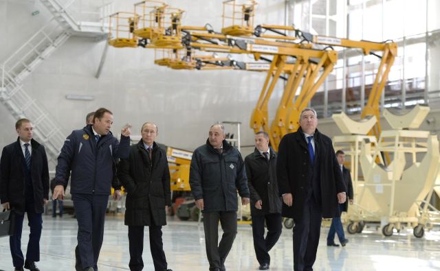 Vladimir Putin, center, and Dmitry Rogozin, far right, tour Russia's new Vostochny Cosmodrome in October 2015.