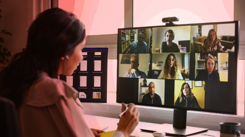 A woman using Zoom to teleconference.