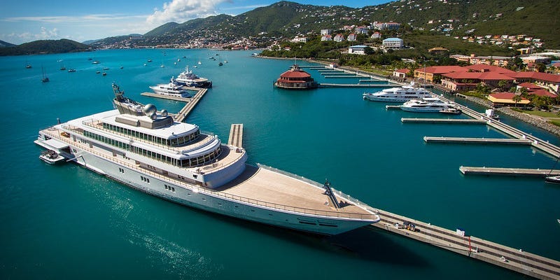 A superyacht at a port.