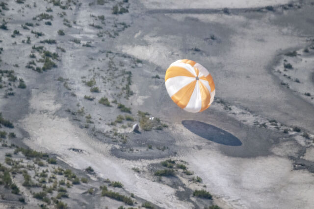 A training model of the sample return capsule is seen is seen during a drop test in preparation for the retrieval of the sample return capsule from NASA's OSIRIS-REx mission.