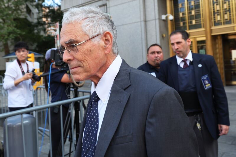 Joseph Bankman, father of former FTX CEO Sam Bankman-Fried, walks out of a courthouse.