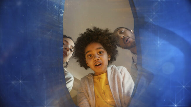 child looking inside a bag