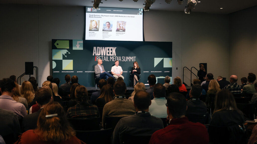 Two men and one woman on stage. Text behind them is a logo: Adweek Retail Media Summit.