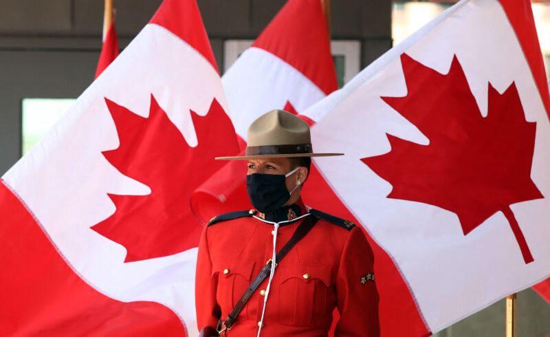 A Royal Canadian Mounted Police officer stands guard outside the Senate of Canada prior to the Speech from the Throne on September 23, 2020, in Ottawa.