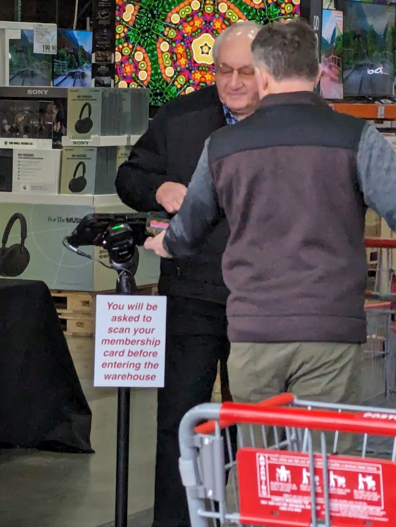 A Costco employee scans a shoppers ID at the entrance to the company's warehouse in Issaquah, Washington.