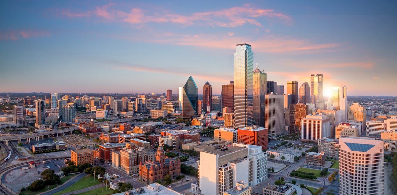 Dallas, Texas cityscape with blue sky at sunset, Texas