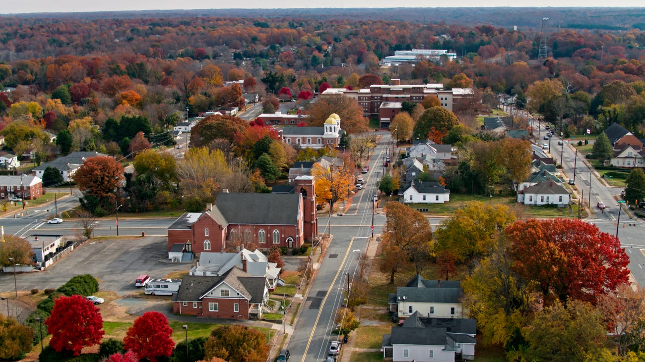 Above shot of downton Winston-Salem with red and orange trees.
