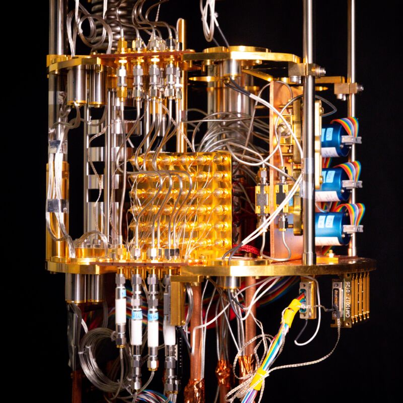Image of a complicated set of wires and cables hooked up to copper colored metal hardware.
