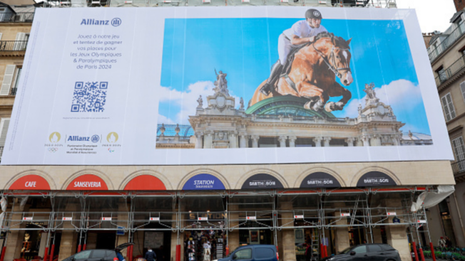 a billboard of a horse and jockey on a building in Paris