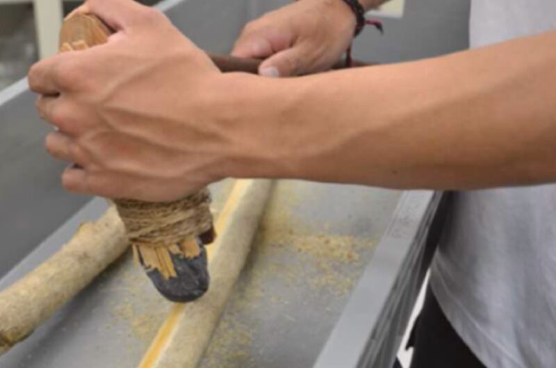 Testing replica Stone Age tools with a bit of wood-scraping.