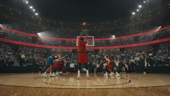 A basketball player shoots a free throw in a Coke Zero Sugar ad