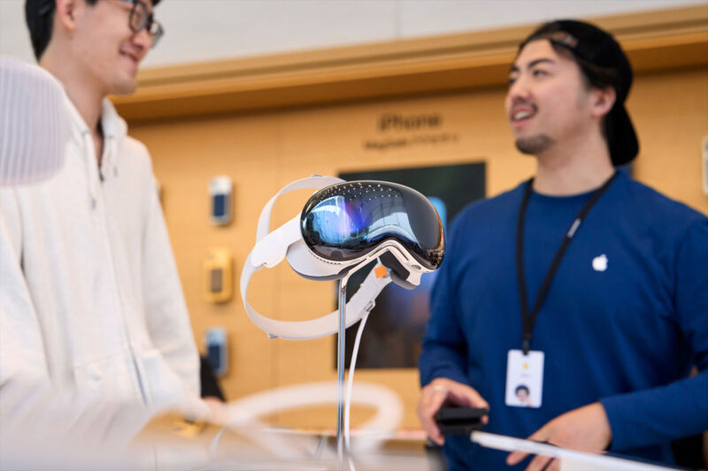 A mixed reality headset over a table in an Apple Store