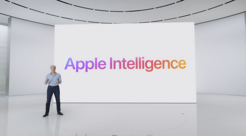 Craig Federighi stands in front of a screen with the words 