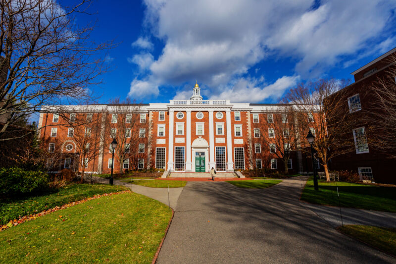 A formal red brick building on a college campus.