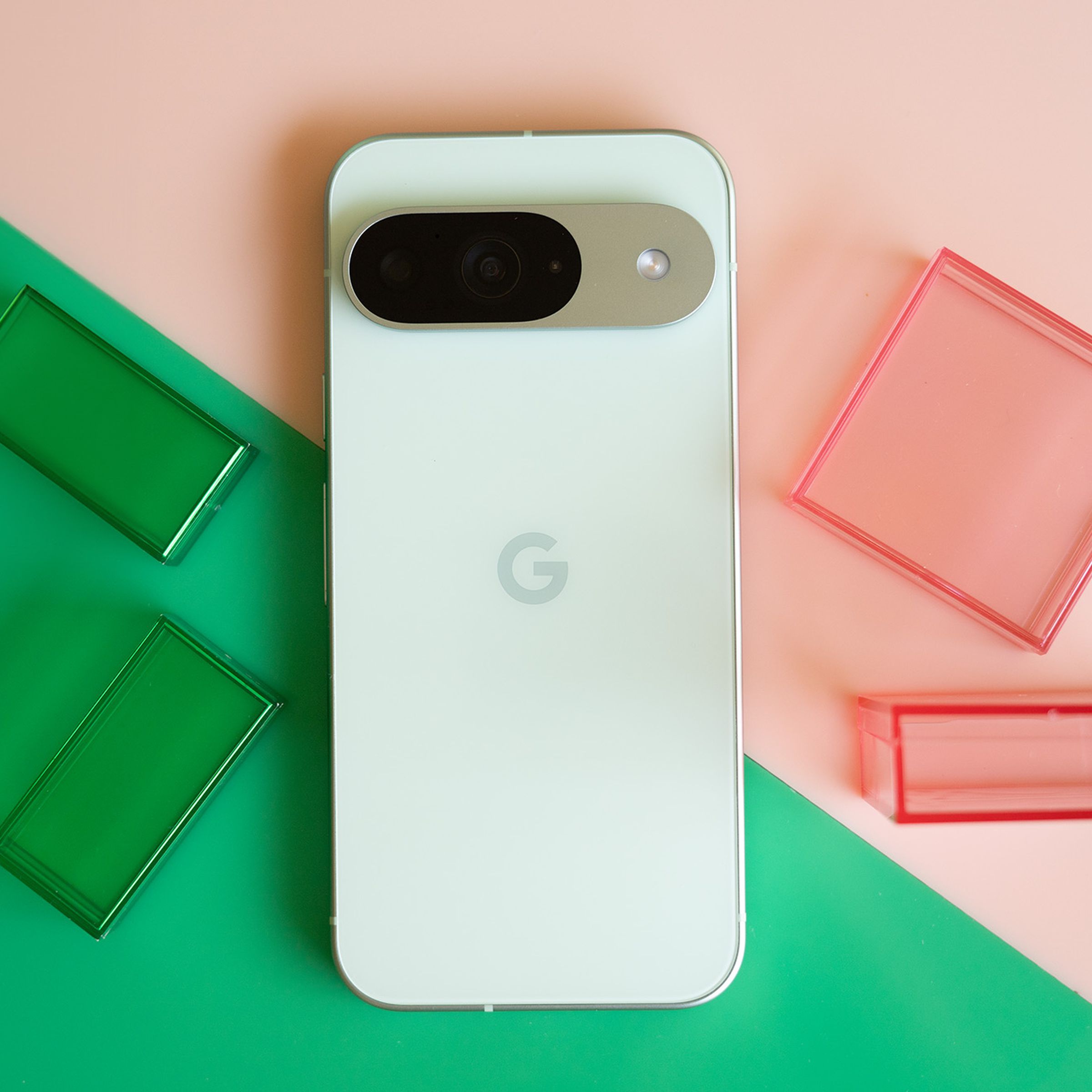 Google Pixel 9 on a pink and green background.