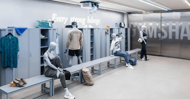 inside of gymshark regent street store image features mannequins wearing gymshark clothing in a locker room