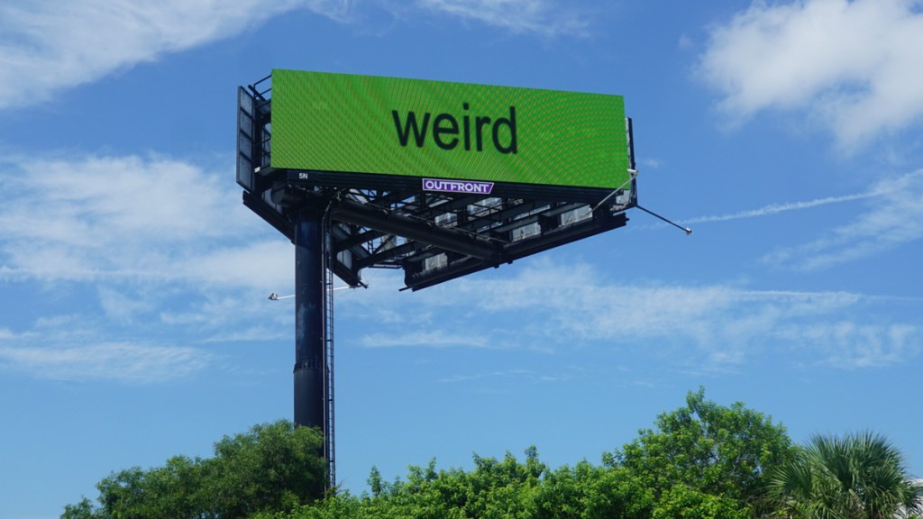 weird billboard in florida with brat green background