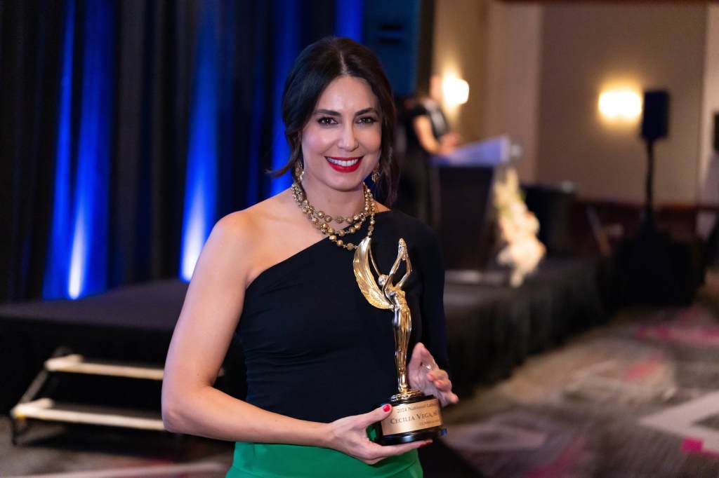 Cecilia Vega with the National Latina Journalist of the Year award from the NAHJ.