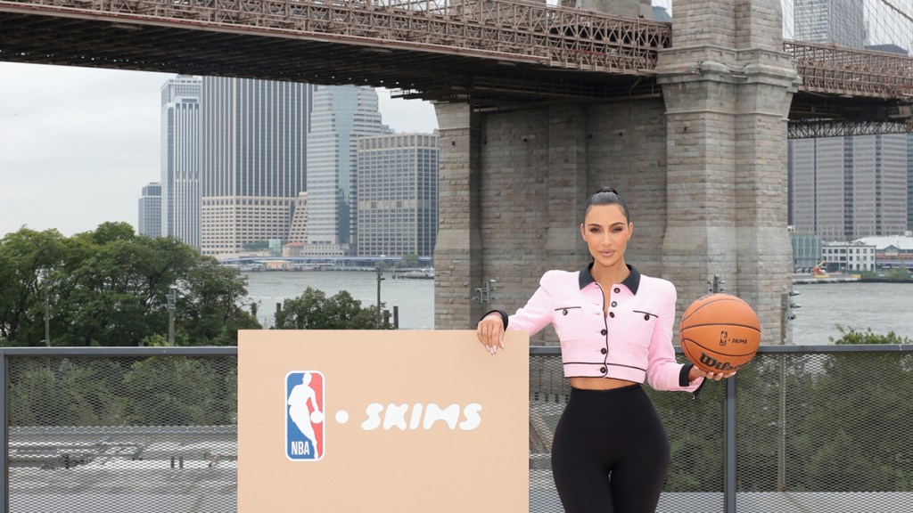 kim kardashian holding a basketball