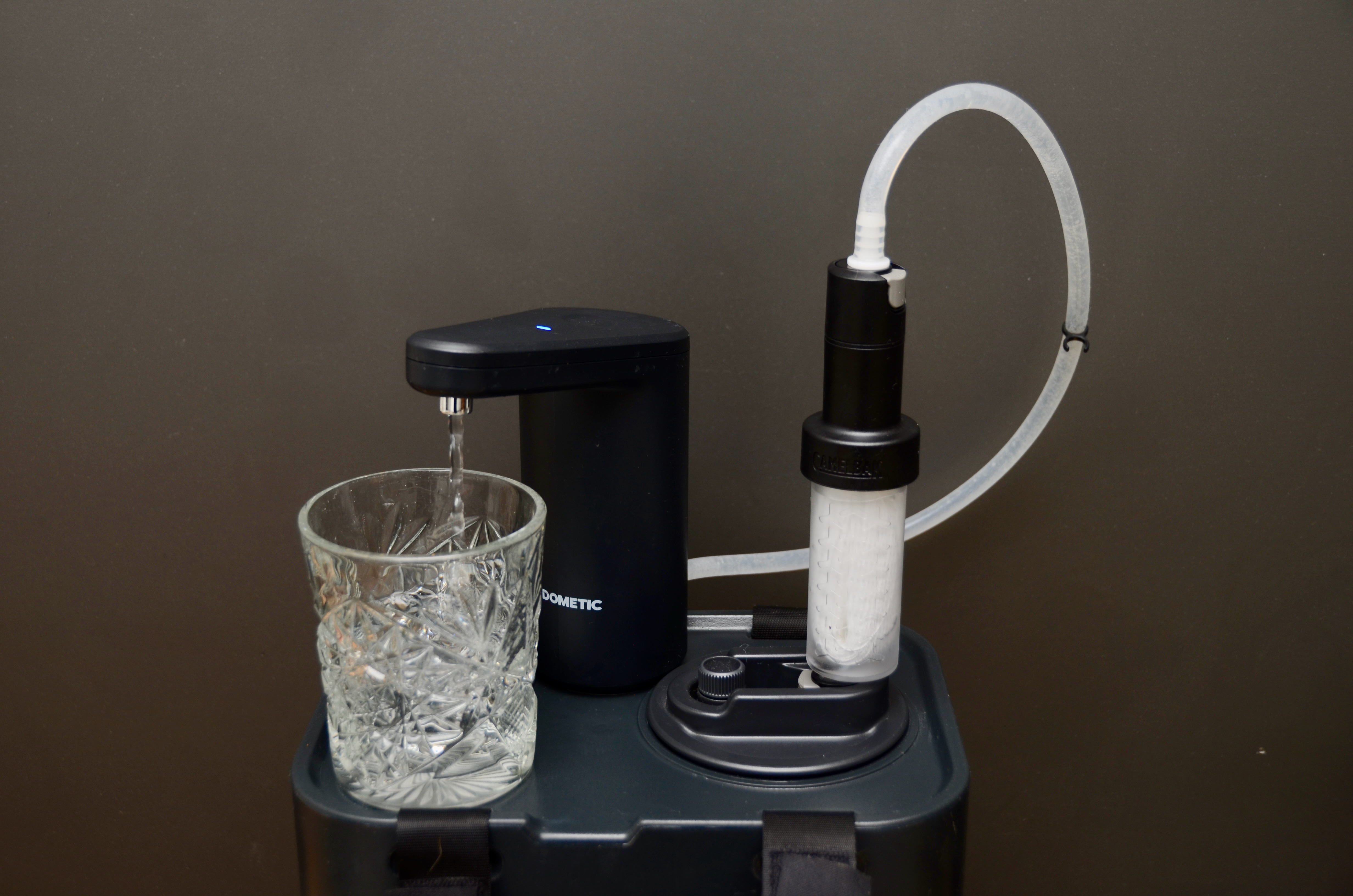 A double-tap of the Dometic Go faucet produces clean drinking water from the LifeStraw filter snapped into the Go jug.