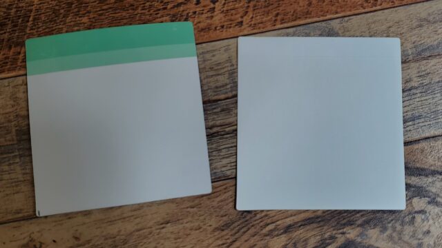 A picture of the back of an unsued Reusable Sticky Note (left) and used one with the adhesive covering removed (right).