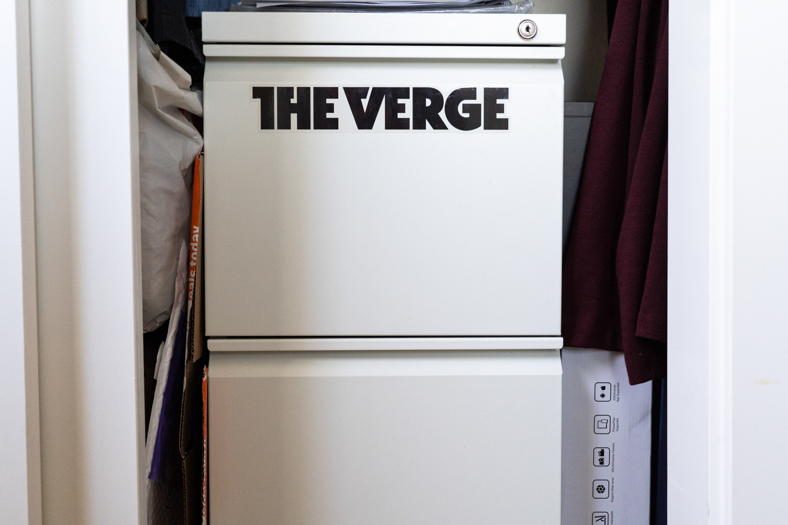 A white filing cabinet labeled The Verge.