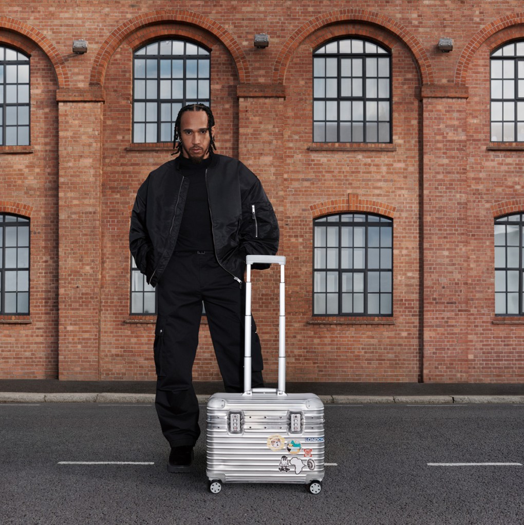 lewis hamilton with a rimowa suitcase