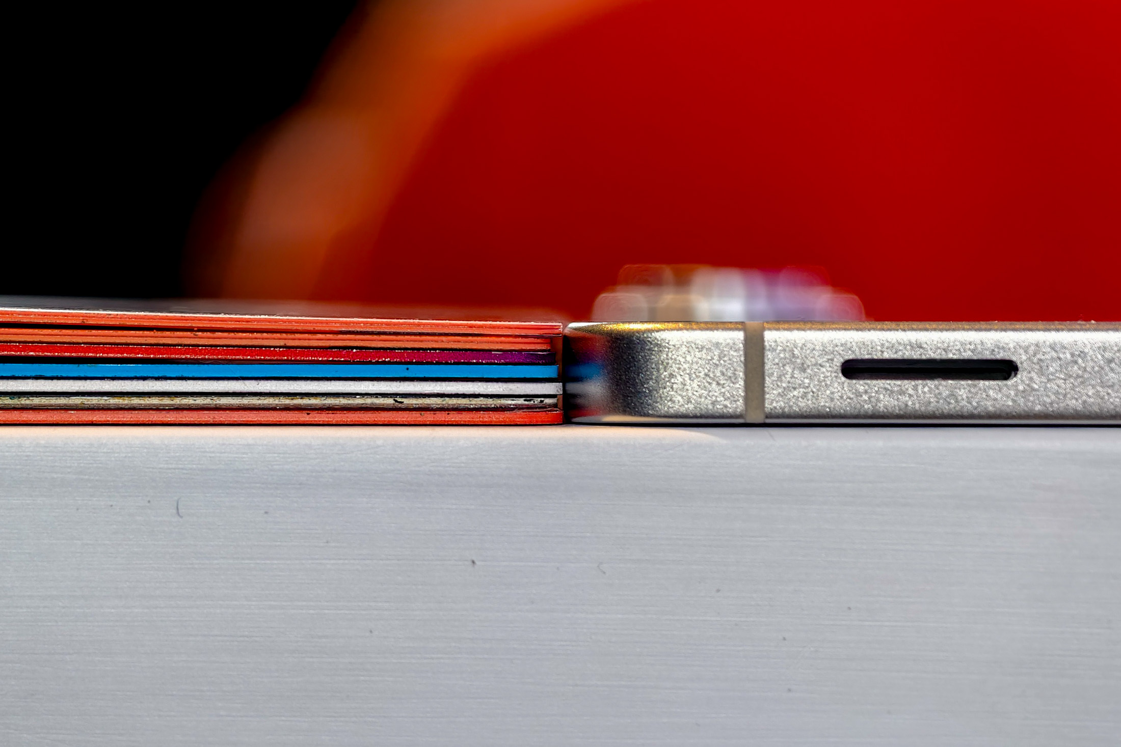 Samsung Galaxy S25 Edge next to a stack of credit cards