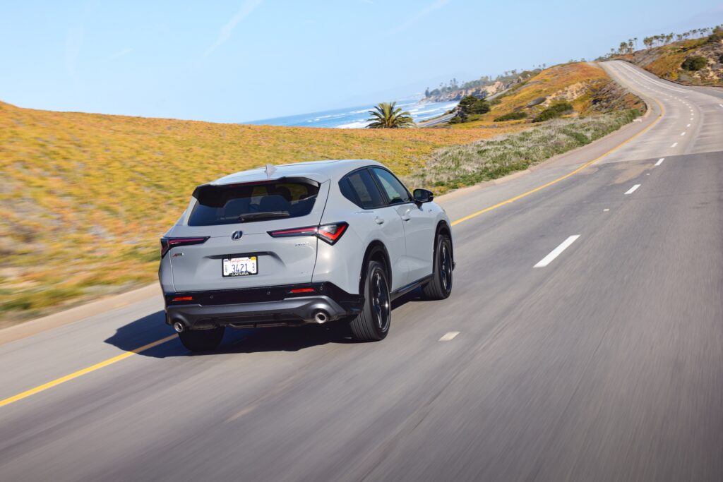 An Acura ADX drives away from the camera