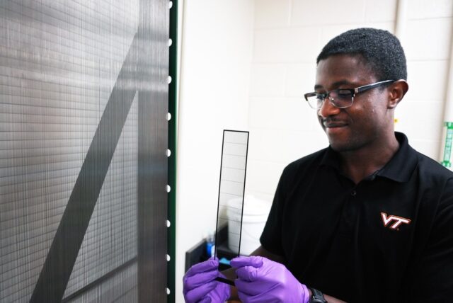 Jimmy Kaindu inspects a new collecting prototype beside the original fog harp.