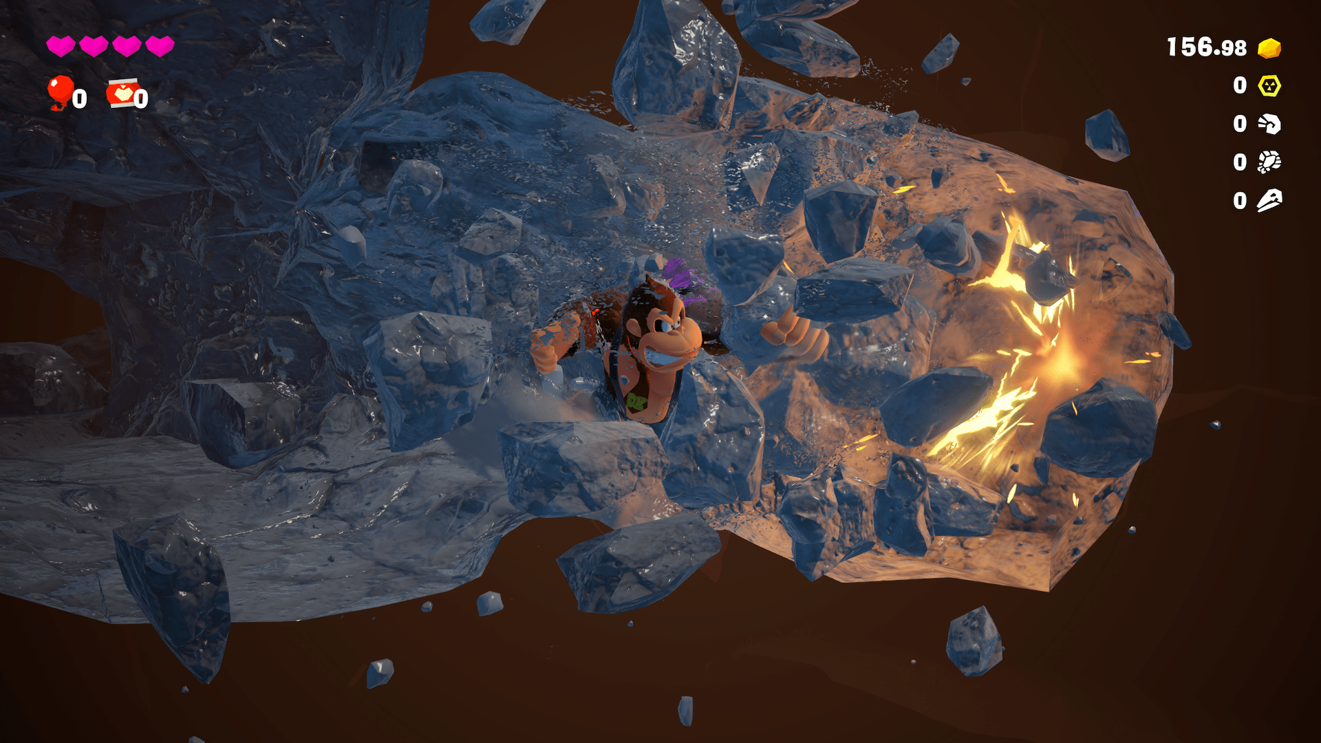 Screenshot from Donkey Kong Bananza featuring the ape Donkey Kong with a small purple rock on his shoulder, punching through bedrock.