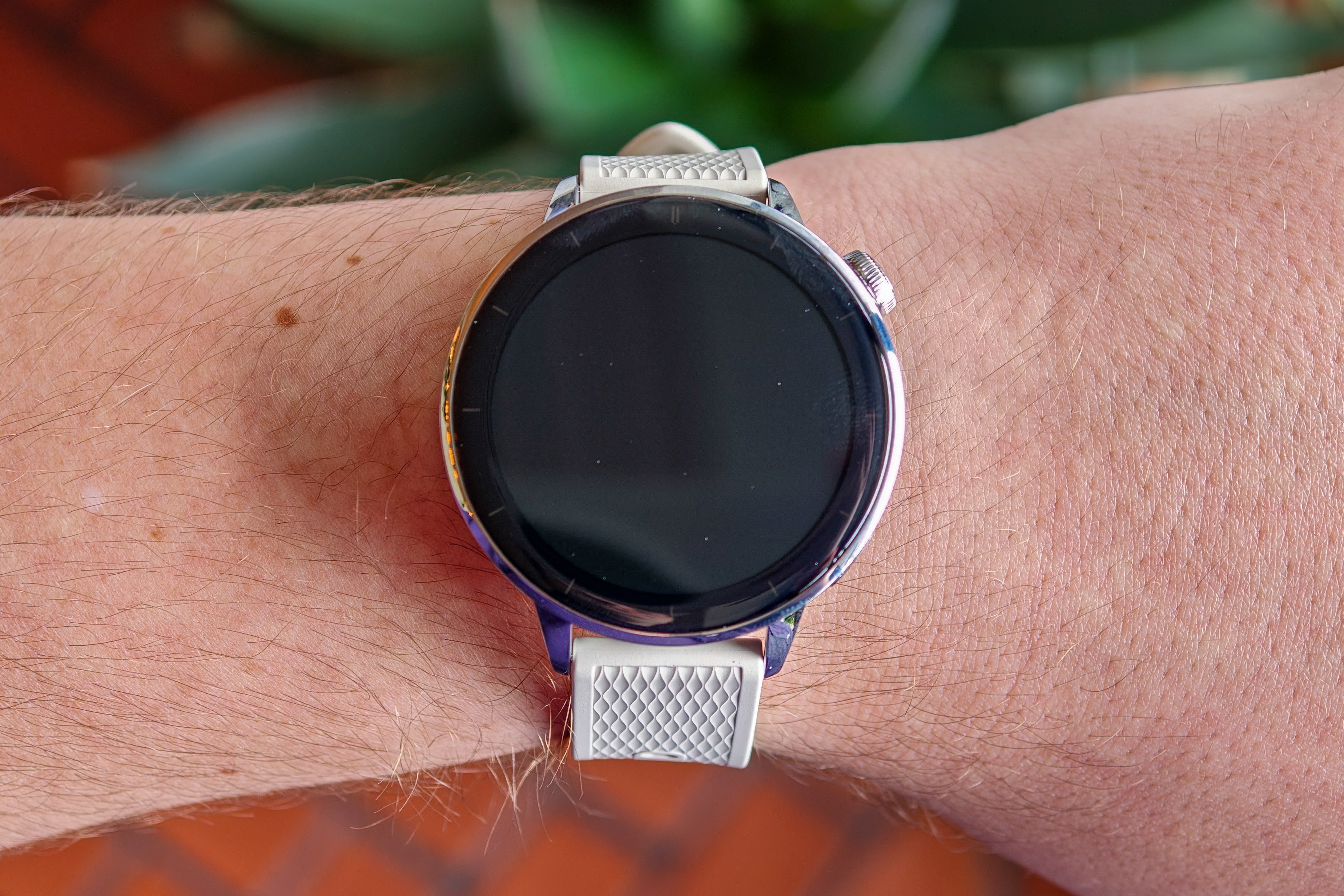 OnePlus Watch 3 43mm on a man’s wrist with the screen off