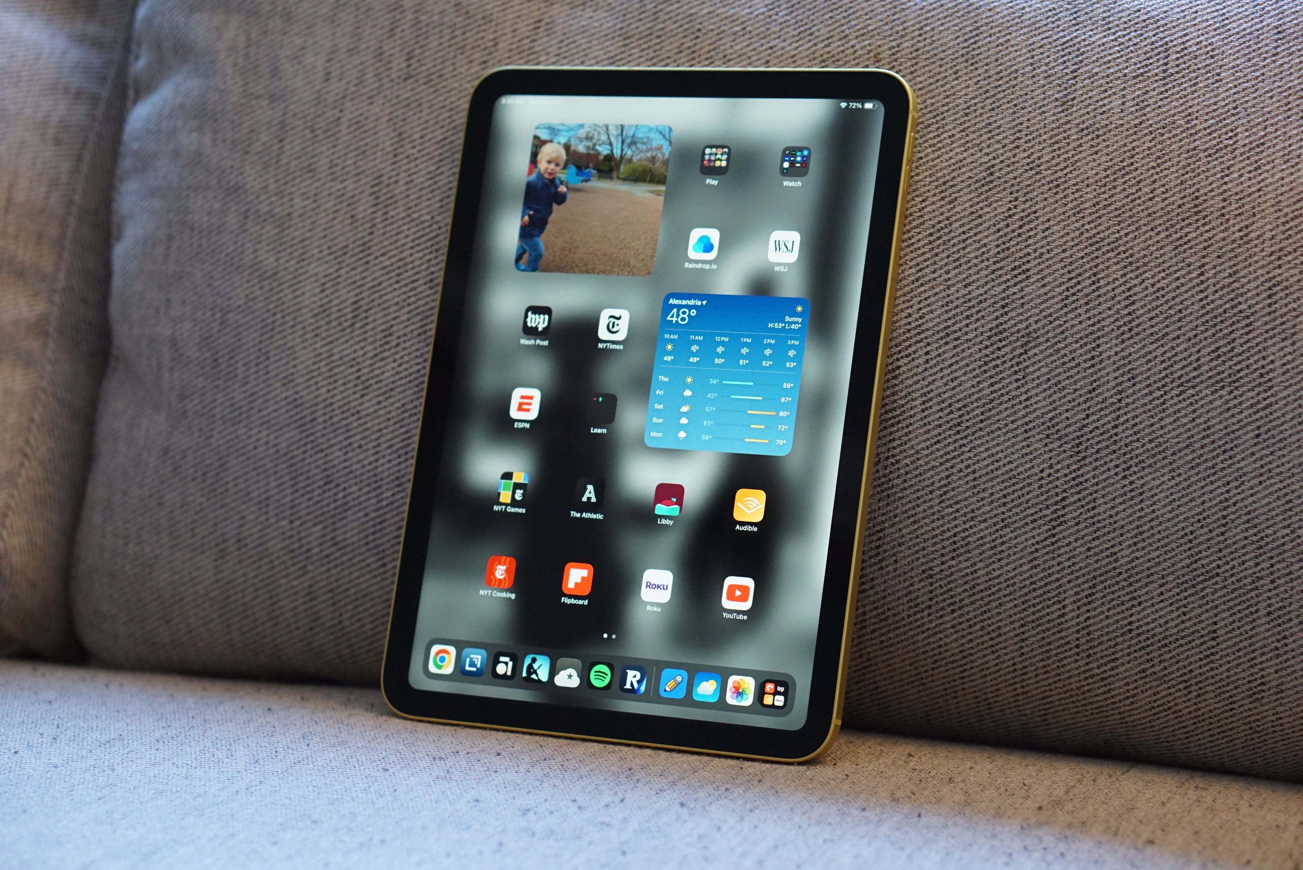 An 11th-generation iPad on a couch.