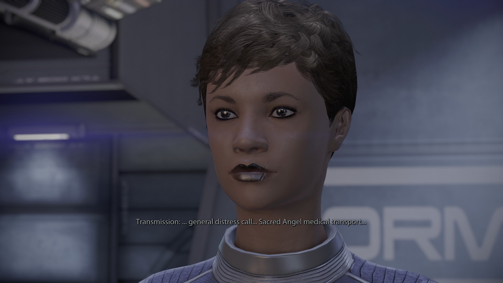 Screenshot from Mass Effect featuring a brown female with dark hair and dark lipstick