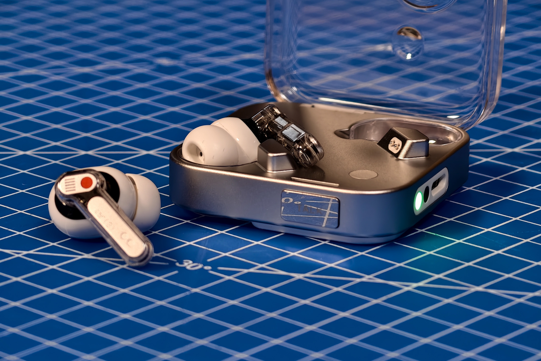 Nothing Ear 3 in the case on a blue mat