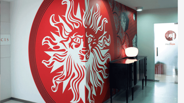 12 new client wins helped the network offset global economic uncertainty.