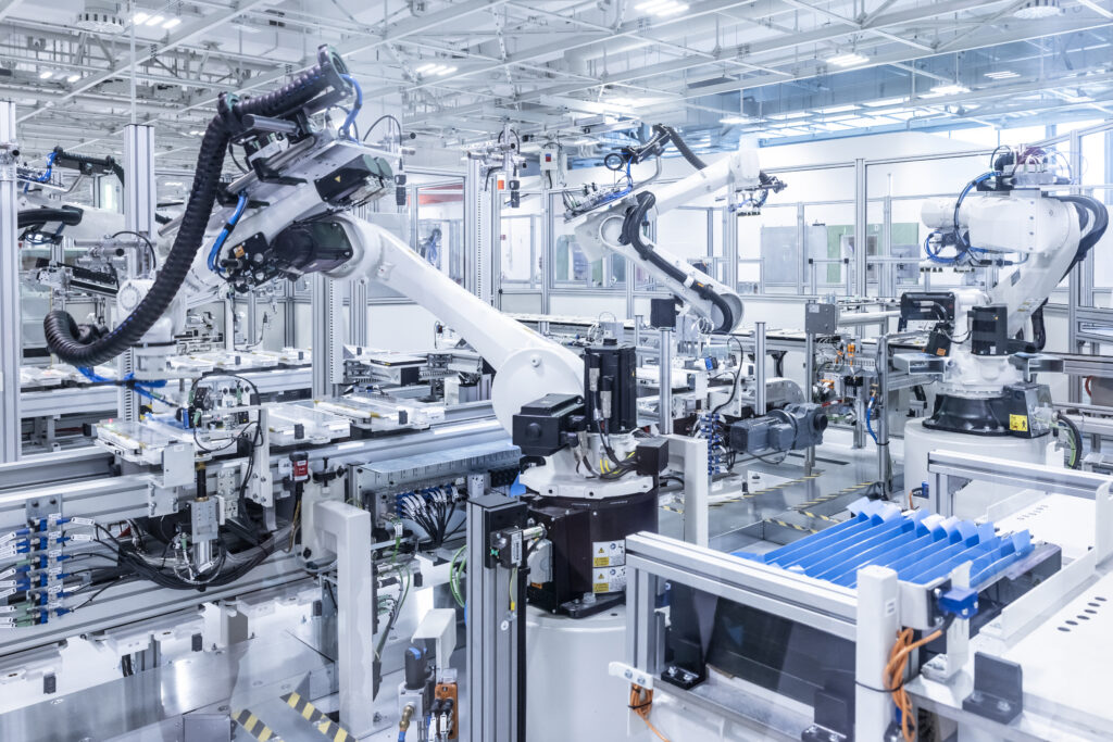 Robots assemble battery packs at the Ferrari factory.