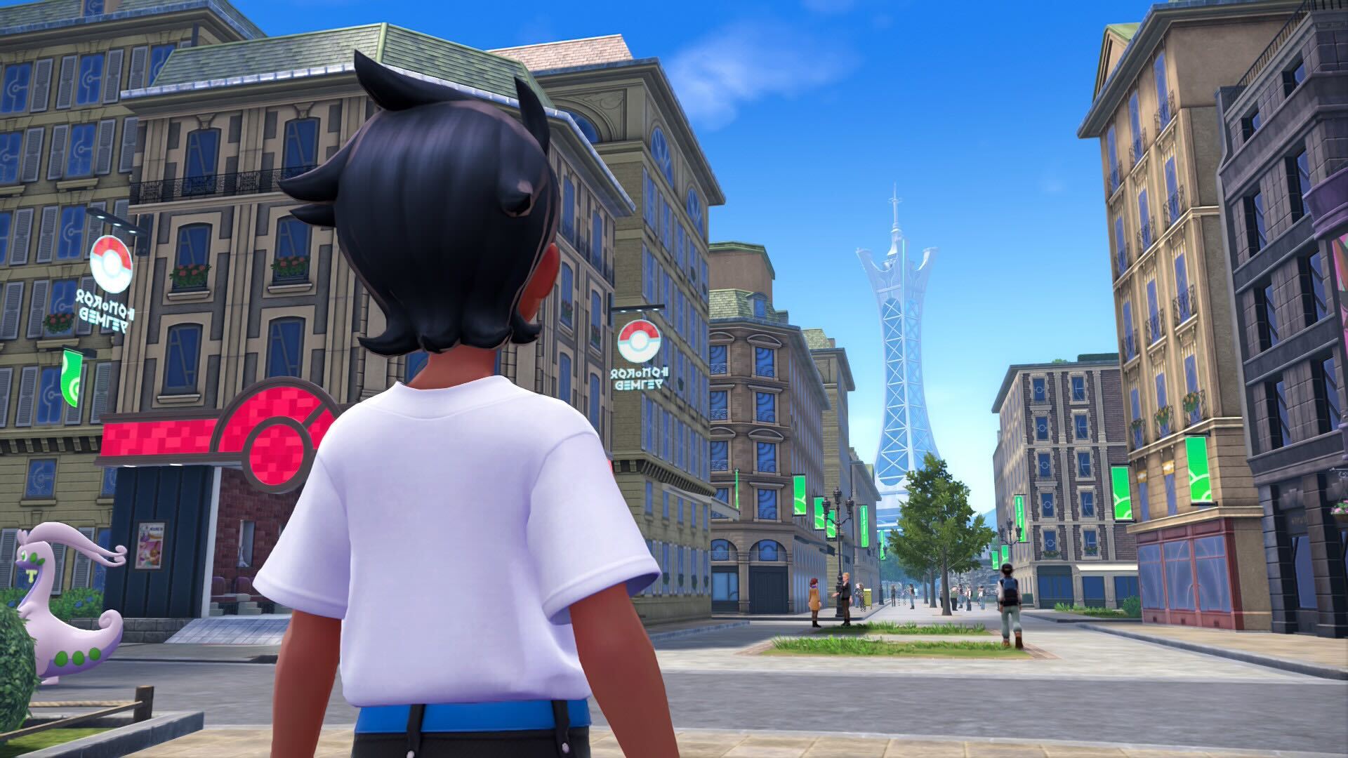 A Pokémon Legends: Z-A screenshot depicting a trainer standing on a sidewalk downtown and looking at a massive tower in the distance.