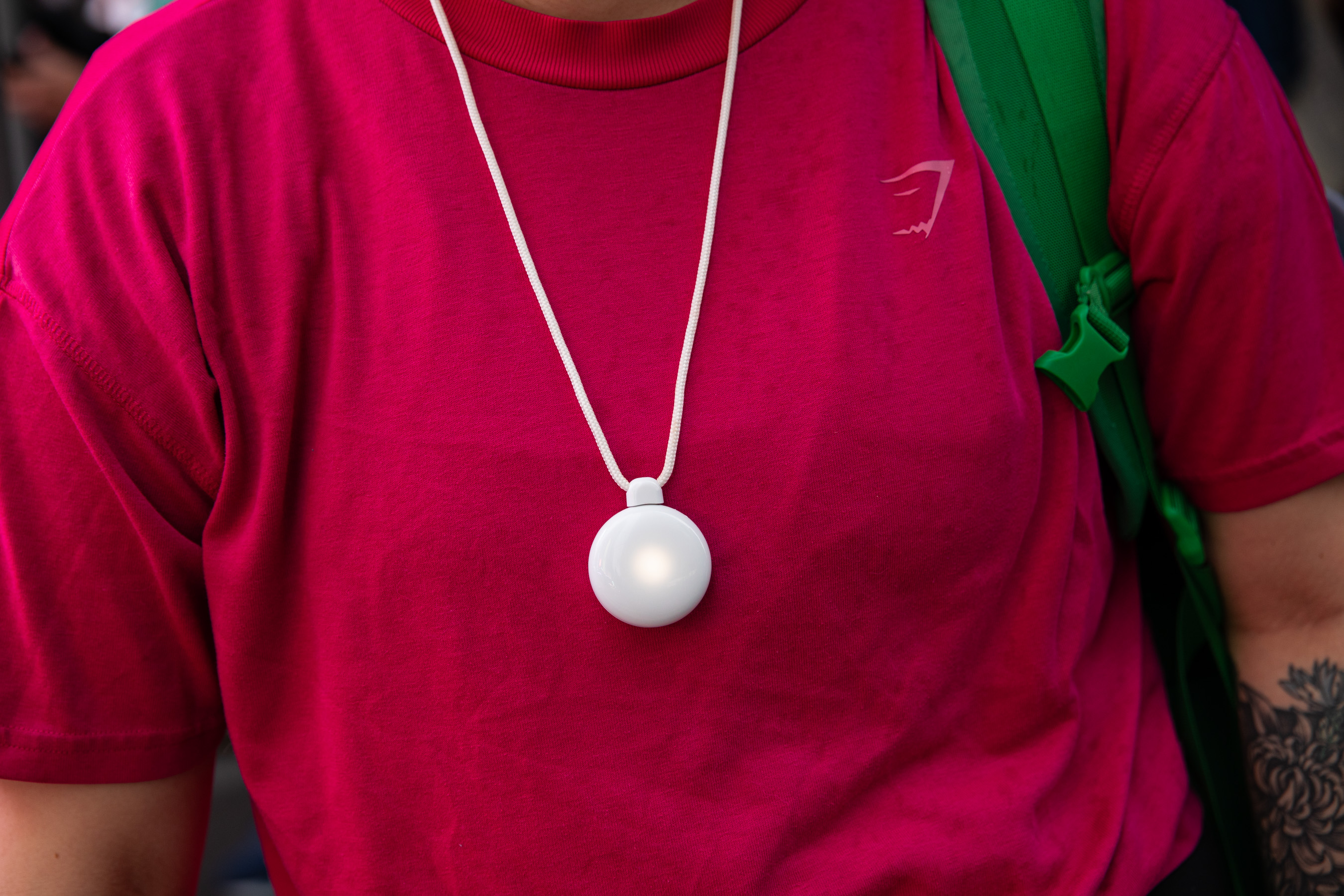 close up of Friend glowing on person’s neck