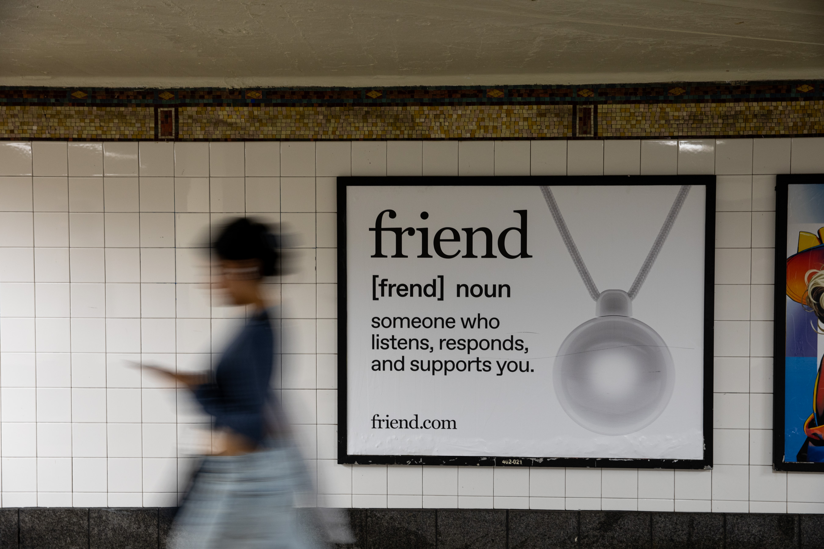 Photo of Friend ad in new york city subway as a blurred person walks past it.