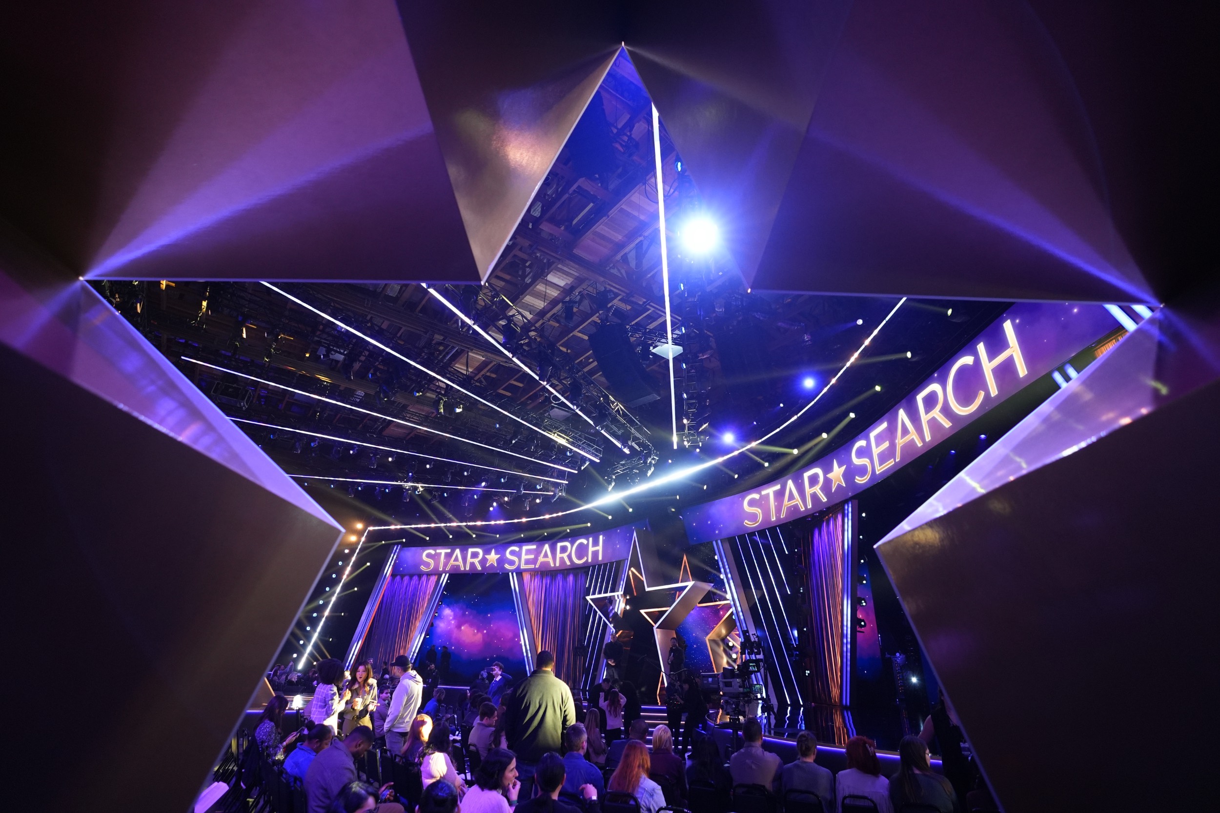 A photo of a studio, shot through a large star standing on the ground.