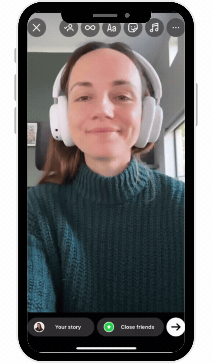 Instagram stories Boomerang mode showing smiling woman with headphones in selfie video interface with editing icons and share options